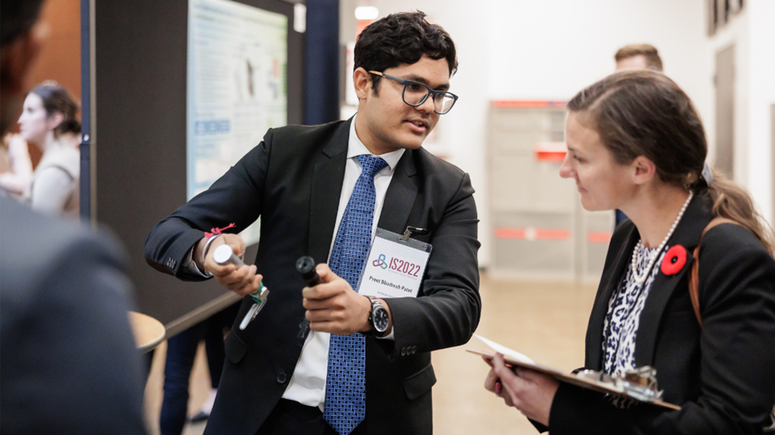 two people talking at the Innovation Showcase