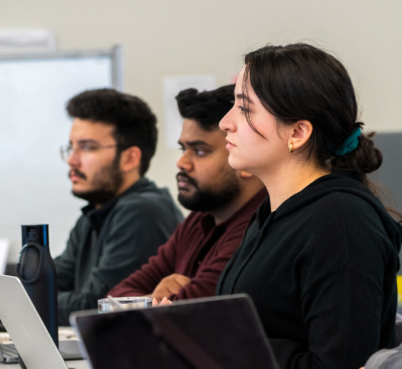 Students taking notes in Design Thinking class