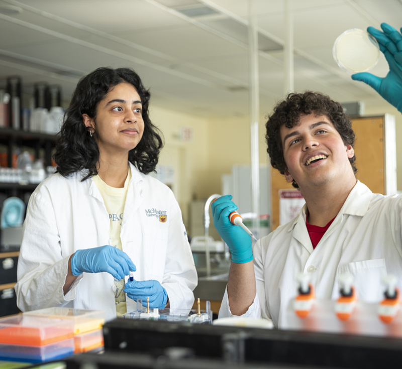 Two students working in a lab with medical instruments