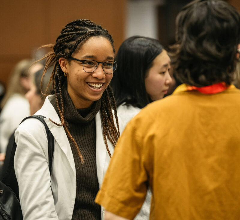 Someone smiles while networking at the women in engineering industry event.