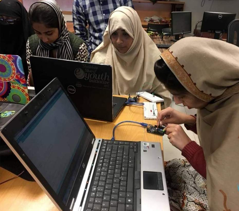 young girls working on laptops.