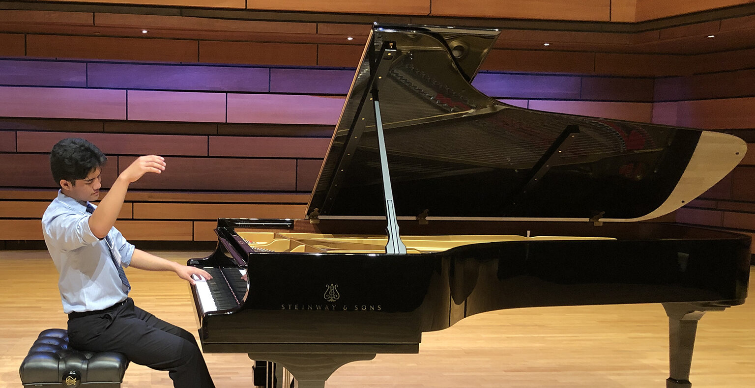 Aidan Lao at a grand piano