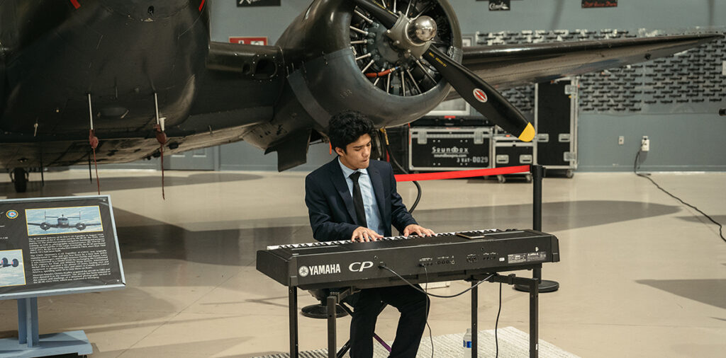 Aidan Lao playing at the Canadian Warplane Heritage Museum