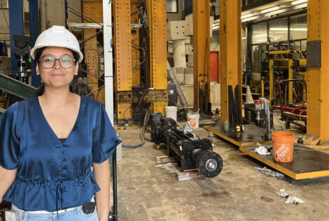 Muskan Amaresh standing at the entranceway to a advanced dynamics laboratory