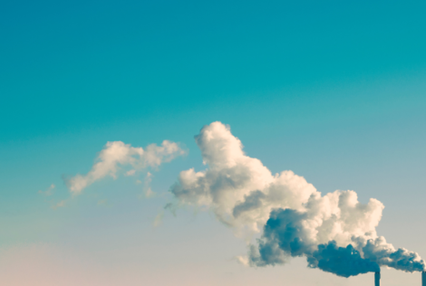 clouds of carbon dioxide emission coming out of a building.