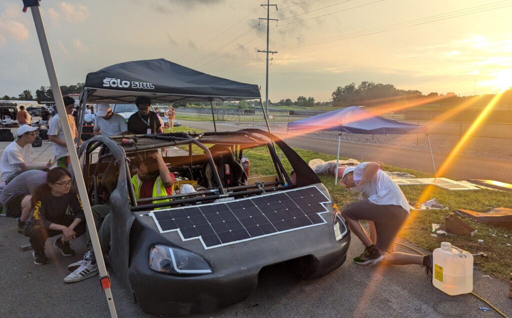 McMaster Solar Car team assembling their car at the competition