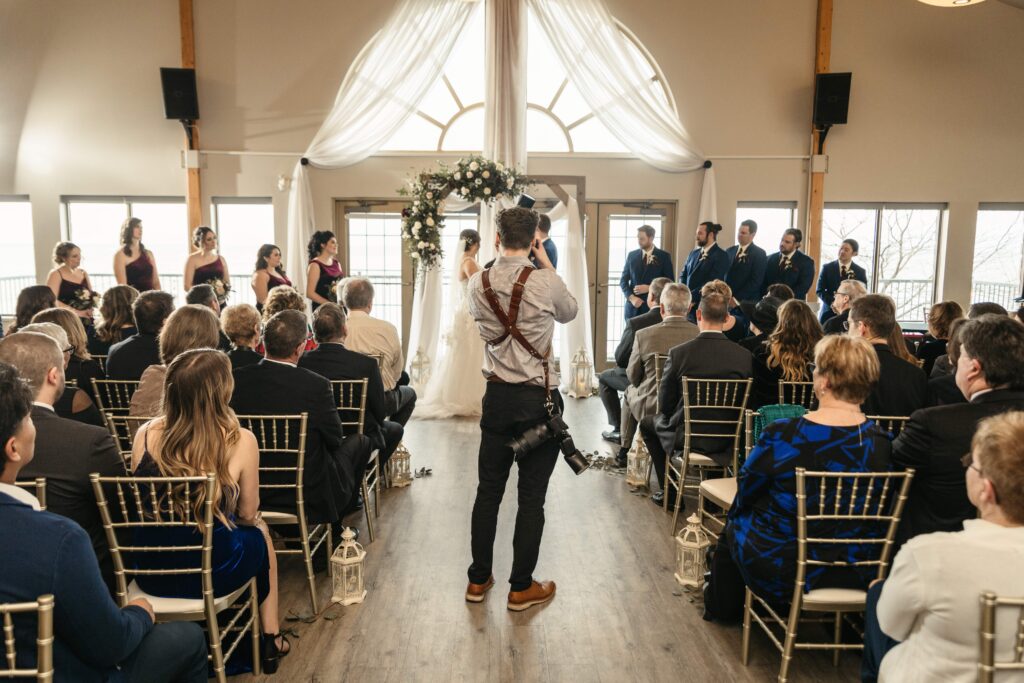 Geoff shaw photographing a wedding ceremony