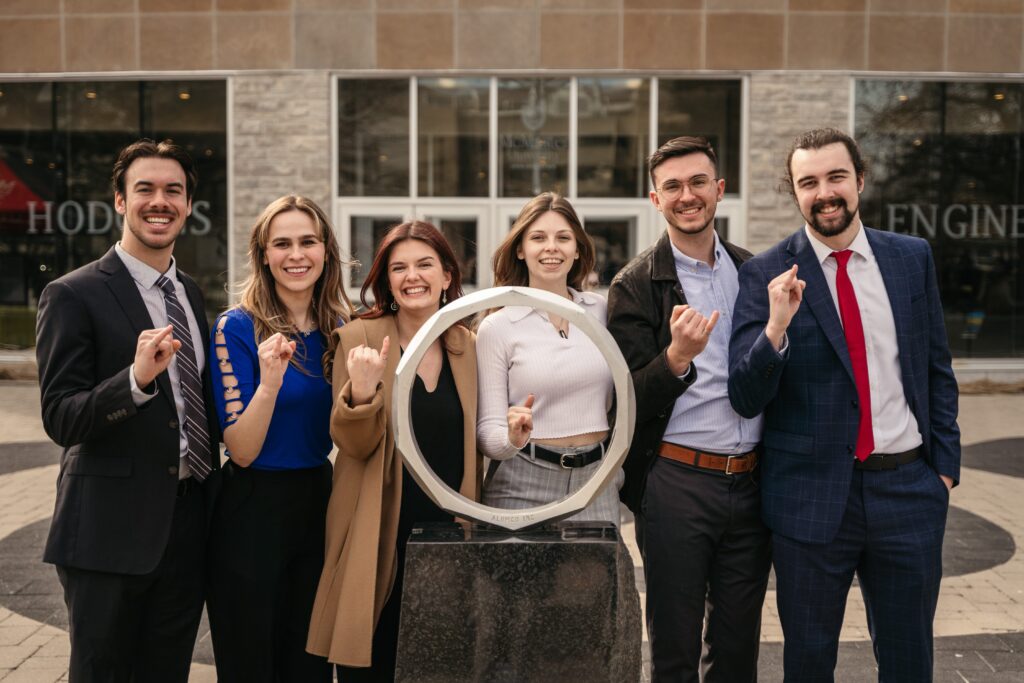 Group of Engineering student in front of the iron ring