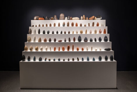 Sculptures illuminated on a white series of shelves