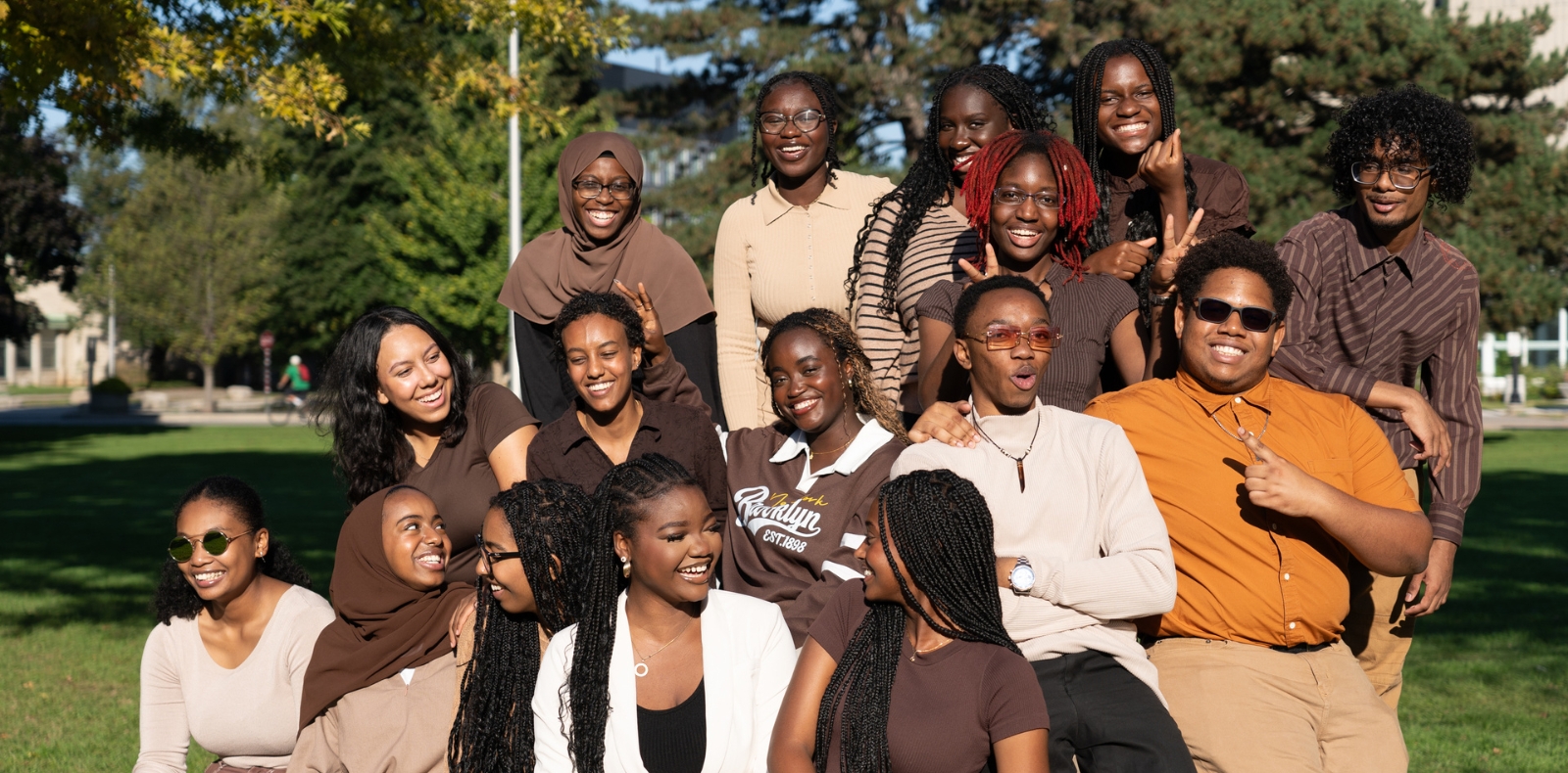 group of black students smiling, laughing, and talking amongst each other