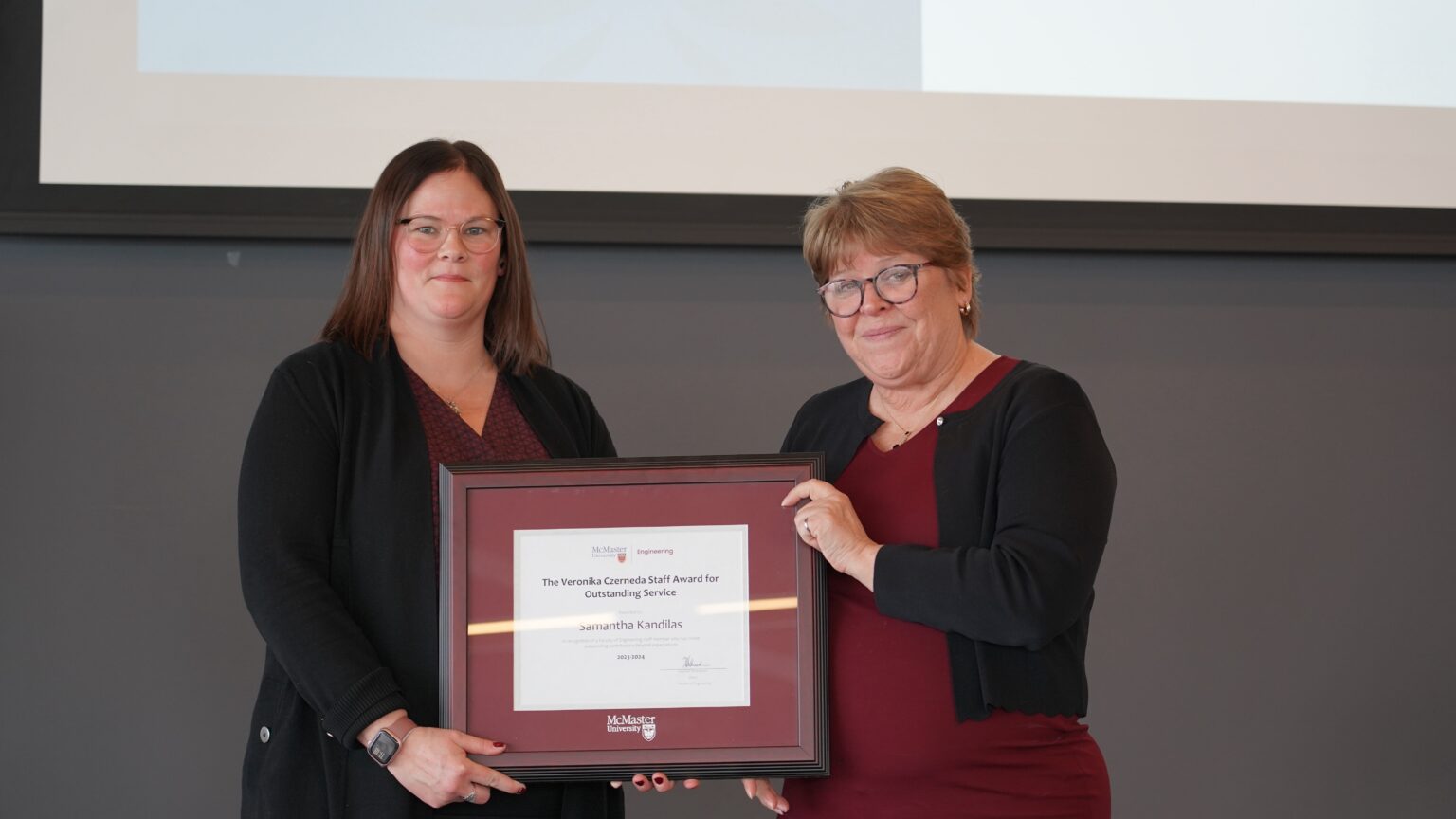 Heather and Samatha with the Veronika Czerneda Staff Award for Outstanding Service